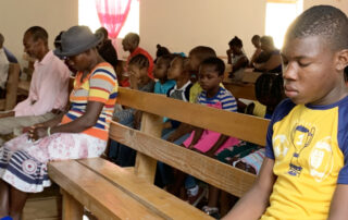 Prayer in church in Haiti