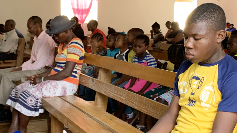 Prayer in church in Haiti