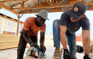 Volunteers cutting wood