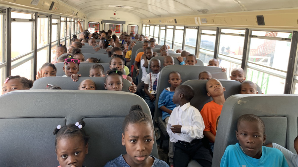 children on bus in haiti