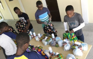 Haitian children packing supplies for those in need