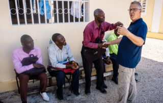 Image of Wiley greeting church members