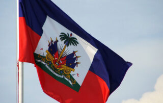 Haitian flag waving in sky