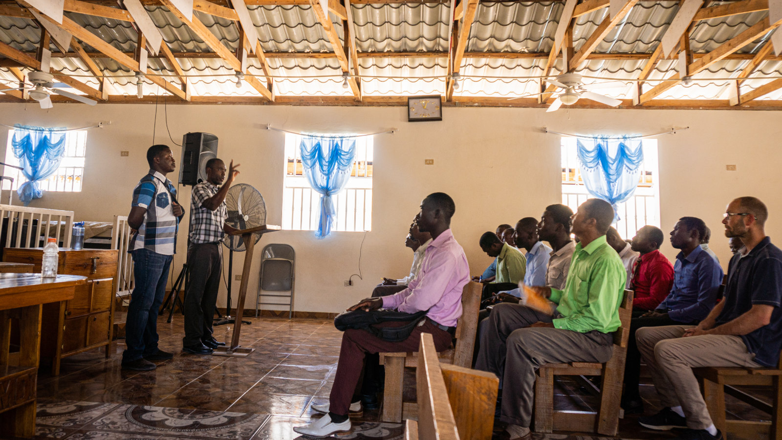 image of pastors addressing their members in a Haiti church