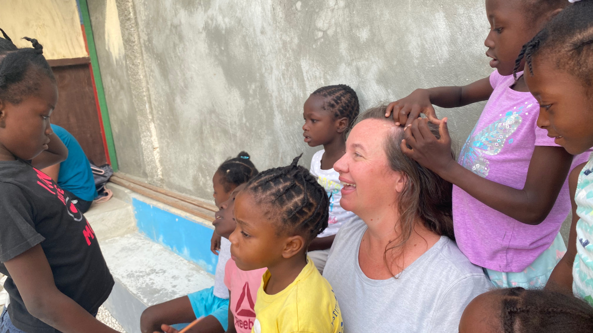 Woman laughing with children