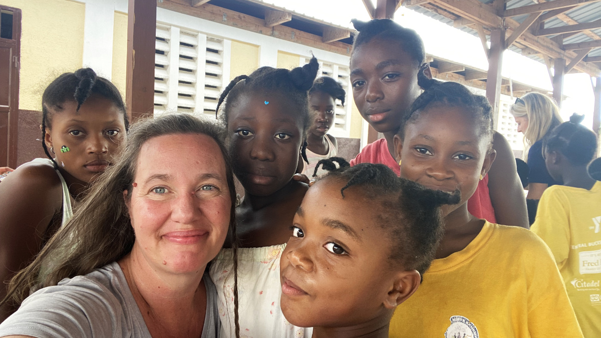 Group selfie of smiling woman and children