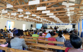 image of people inside a church attending a sermon