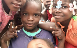 happy smiling Haitian children posing for a picture