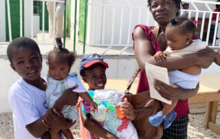 Haitian mother wither four young children