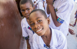 Two Regency male children smiling