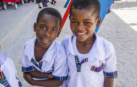 Haitian male children in school uniforms smiling
