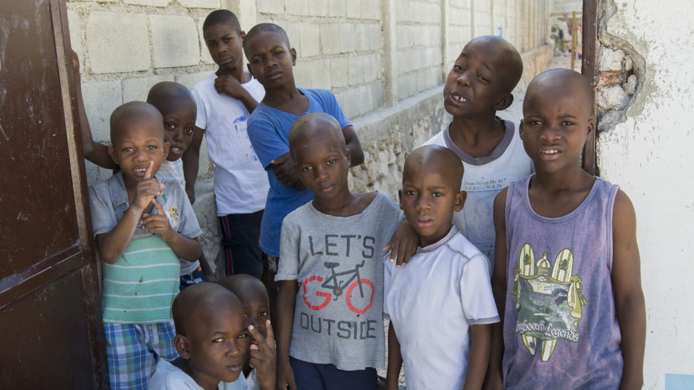 Regency children's home boys gathered and posing for a happy picture.