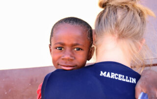 Male Haitian Child with volunteer