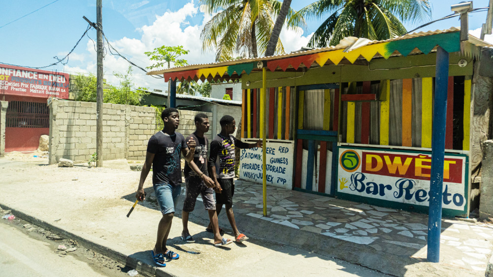 Youth walking in Haiti streets 2021