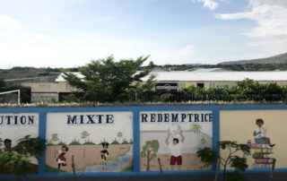 The regency lighting logo on a building in Haiti