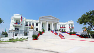 The political house, grand white colonial building decorated in brilliant red and blue drapings