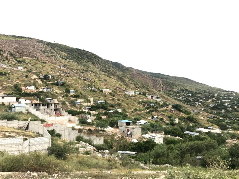 Homes on grassy Hillside in Haiti