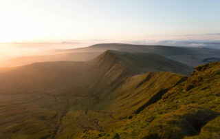 Lush Green Mountain Range at Sunrise