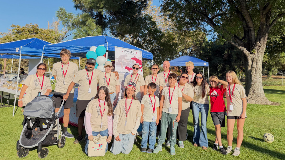 2025-C2M-Volunteers Group of people posing for a picture in a park