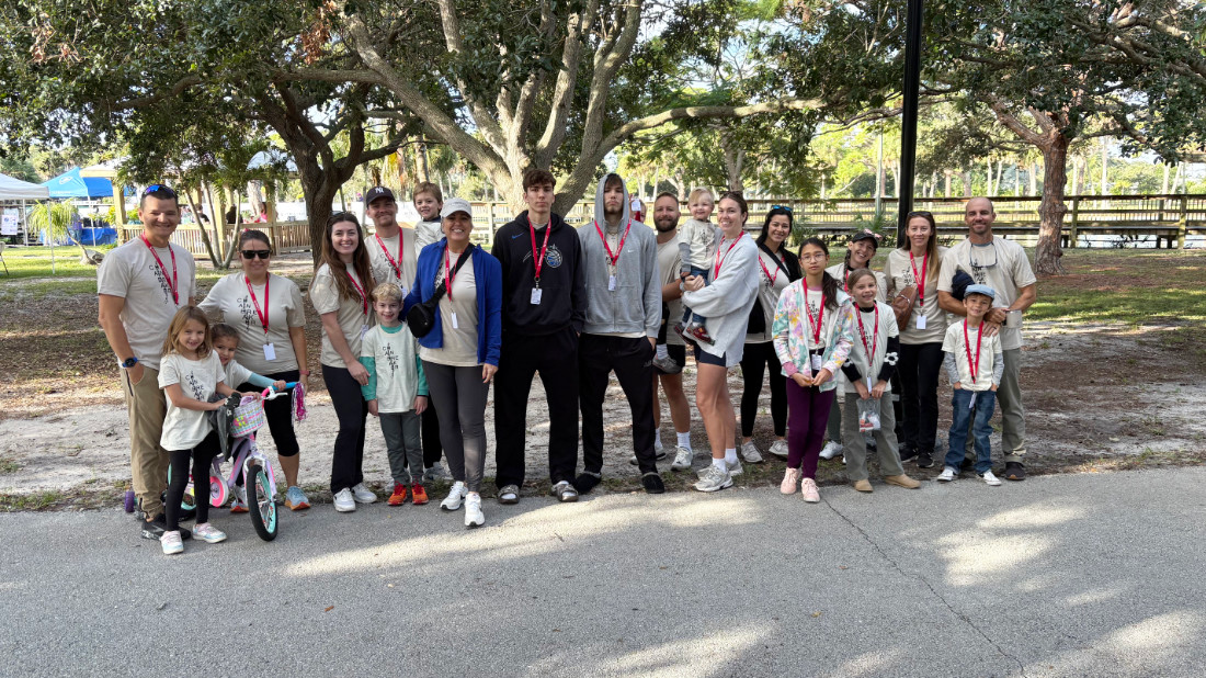2025-Park-Volunteers Group of people posing for a photo in park.