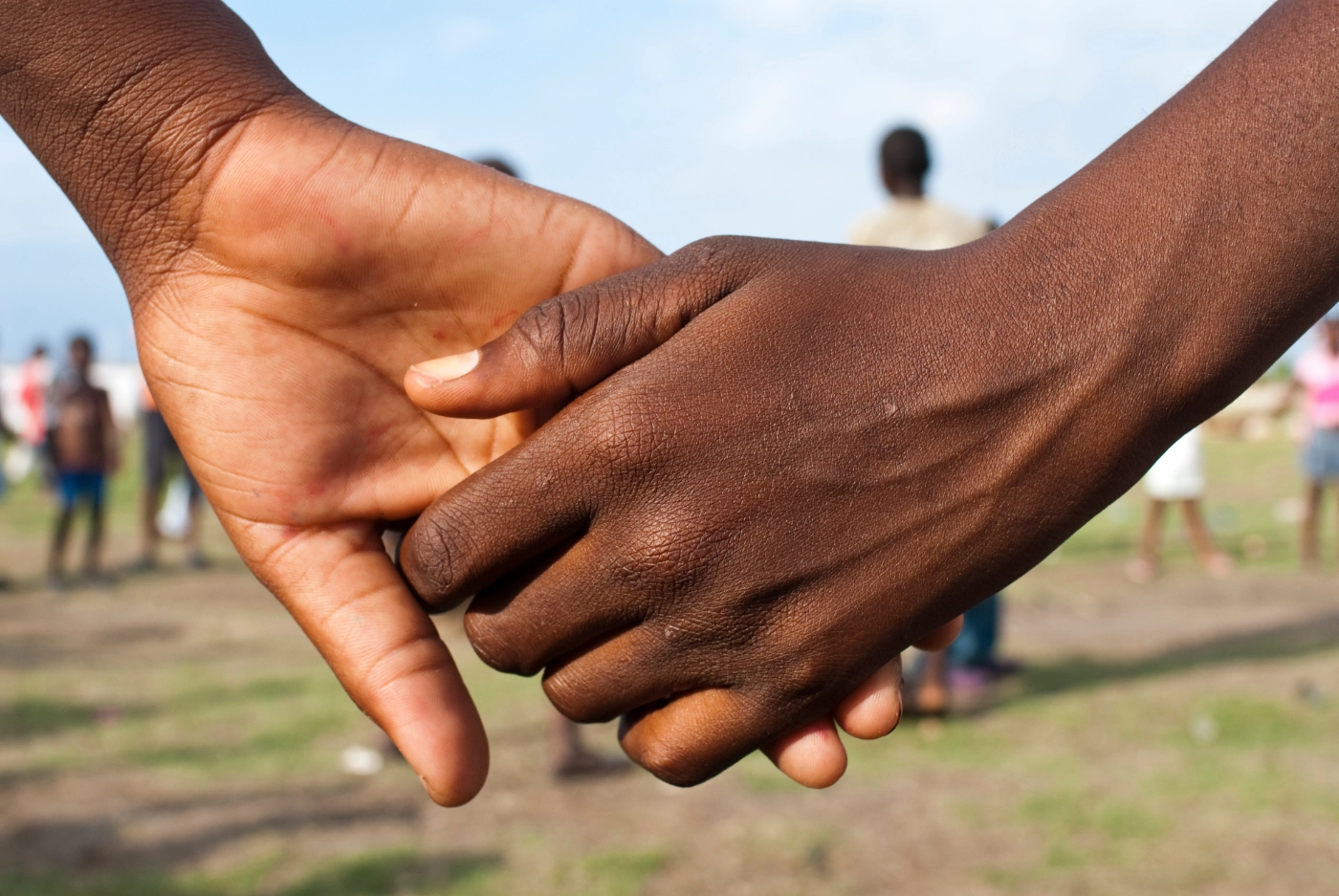 Haitian children holding hands